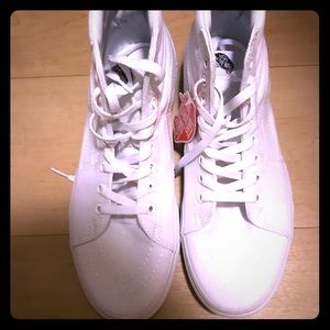 Vans all white high top sneakers.